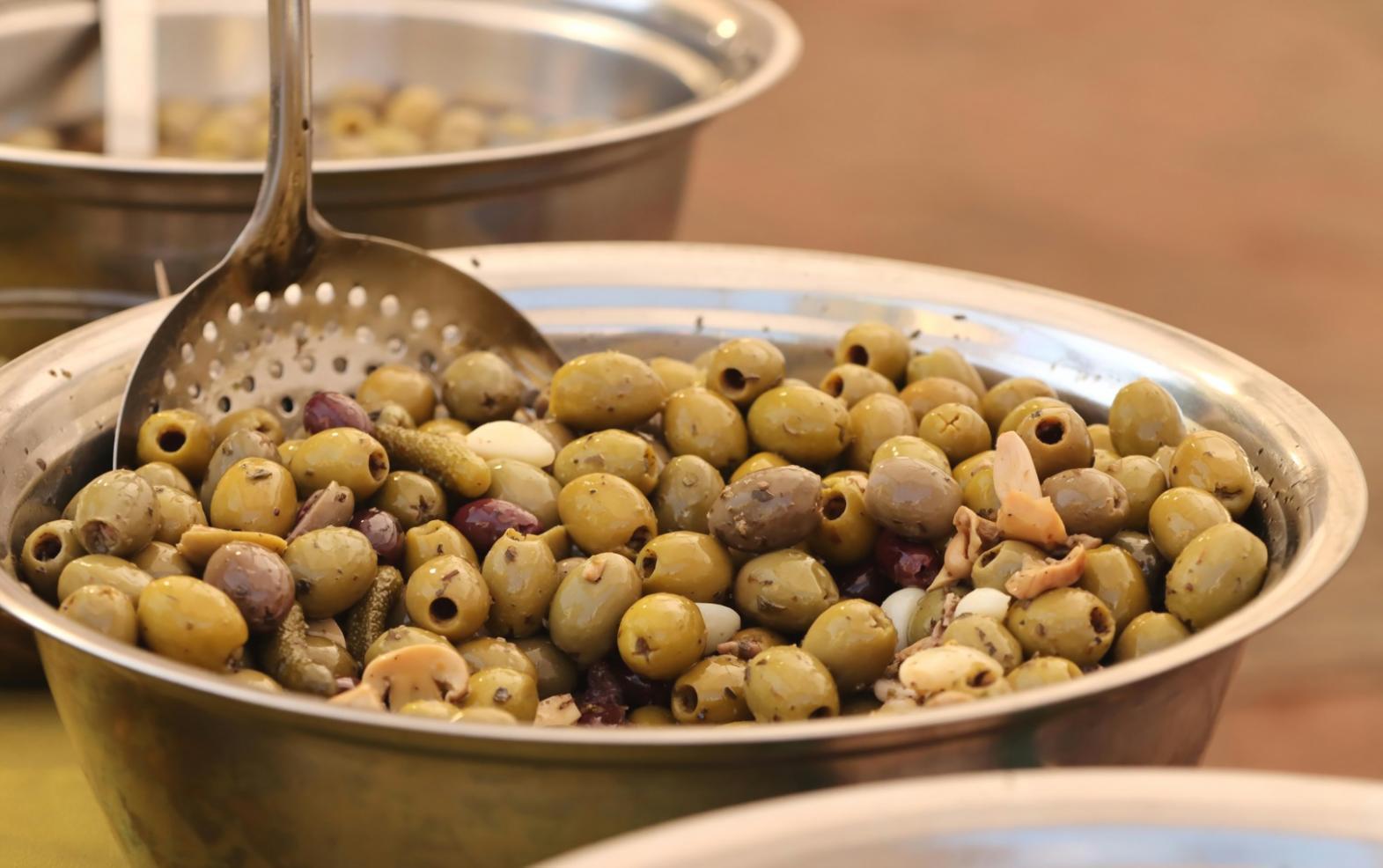 Professional food plating demonstration showing precise technique application